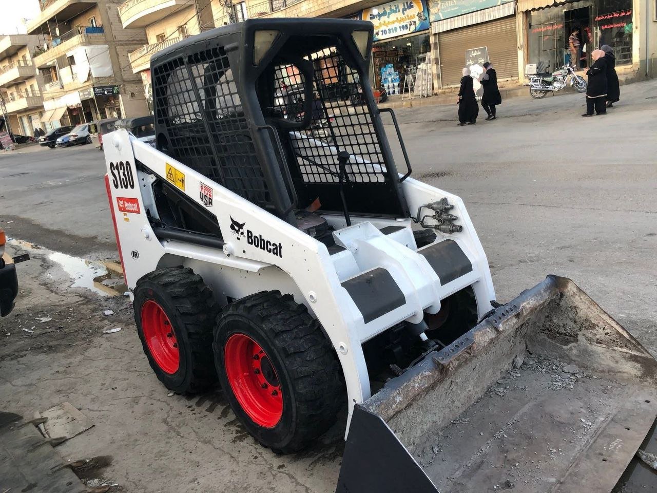 Bobcats for sale in Syria, Bobcat S130 model 2004 exported from Lebanon to Syria, the best site for selling trucks and heavy equipment in Syria.